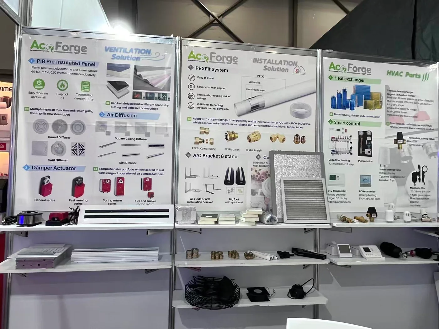 Three product posters covering ventilation, installation and HVAC parts, with sample parts on the shelves below